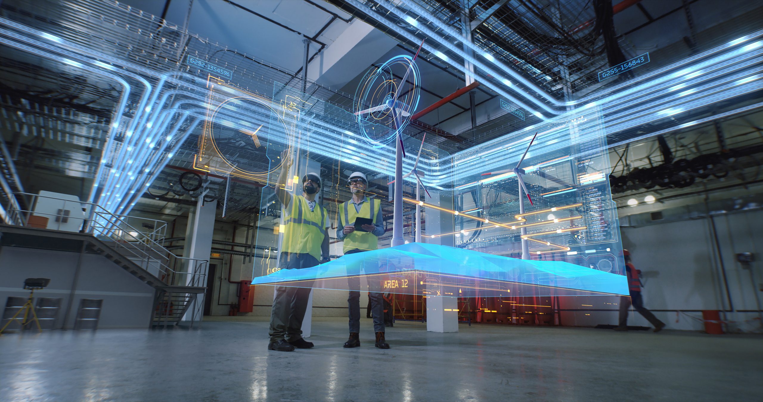 Low angle of male colleagues in vests and hardhats examining and discussing 3D plan of modern wind power station in workshop of factory